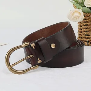 Vintage dark brown cowhide leather men belt with antique brass horseshoe buckle detail close up