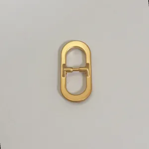 Minimalist gold oval metal buckle strap adjuster for women belt bag garment accessory DIY craft.