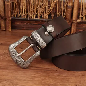 Retro brown genuine leather belt with ornate silver-toned engraved metal buckle and rivet details.