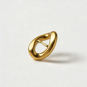 Gold zinc alloy irregular belt buckle detail view, premium metal hardware accessory for apparel.