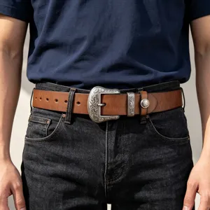 Retro western genuine leather belt with ornate floral engraved metal buckle and rivet details.