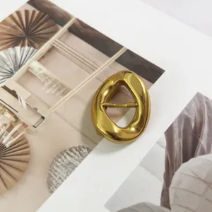 Exquisite irregular gold metal belt buckle accessory, premium zinc alloy detail shot.