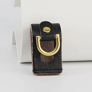 Close-up of handmade genuine leather waist hanging buckle featuring shiny gold D-ring.