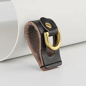 Handmade veg-tanned leather belt loop key holder close-up, premium brass D-ring detail.