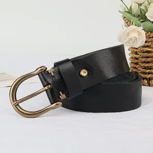 Classic black leather belt detail featuring retro brass horseshoe buckle and fine stitching.