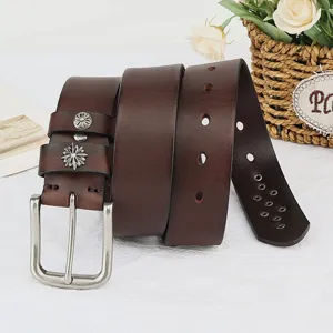 Vintage brown genuine leather men belt with retro silver metal floral rivet decorations detail view