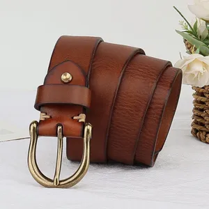 Detailed close-up of brown leather men's belt with vintage brass buckle and fine stitching.