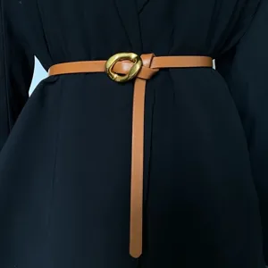 Elegant slim brown leather belt for women with unique irregular metallic buckle stylish accessory.