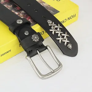 Detail view of handmade genuine leather belt with retro silver cross metal buckle and rivets.
