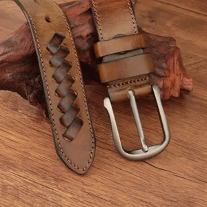 Close-up view of genuine leather retro woven belt detail, showing premium cowhide texture.