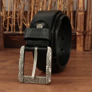 Detailed view of men's leather belt with vintage metal buckle in coiled style.