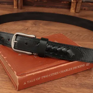 Men's Italian leather braided belt detail showcasing vintage distressed cowhide and metal buckle.