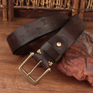 Close-up of retro embossed leather belt detail, featuring genuine cowhide and brass buckle.