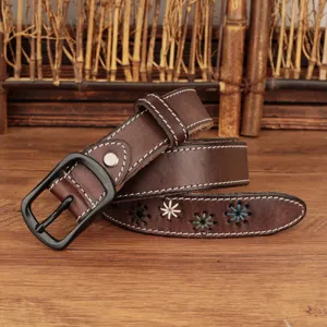 Close-up of a brown leather belt featuring white stitching and colorful embroidered flowers