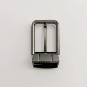 Gunmetal zinc alloy metal belt buckle detail close-up showing pin and clamp connector mechanism.