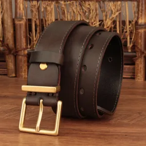 Close-up of classic leather belt with golden square buckle and fine stitching detail.