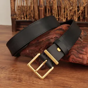 Close-up detail of black top grain leather belt with a classic gold square buckle.