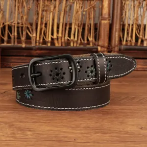 Detailed view of a women's dark leather belt featuring white stitching and floral embroidery