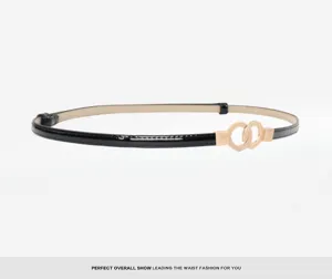 Sleek black patent leather belt detail with a stylish interlocking gold double circle buckle.