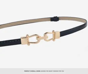 Close-up detail of the black patent leather thin belt with elegant gold horseshoe metal buckle clasp.