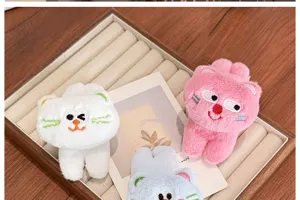 Close-up of cute 3D plush cat hair clips in white, pink, and blue pastel colors