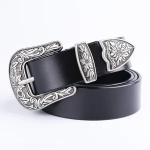 Detail shot of black leather belt featuring vintage silver floral engraved zinc alloy buckle set.