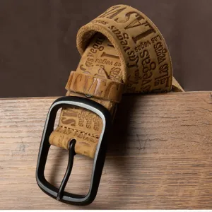 Detailed view of retro brown suede belt with embossed text and matte black metal buckle.