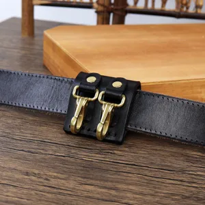 Black leather belt with dual brass key hooks, durable creative belt clip accessory for daily use.