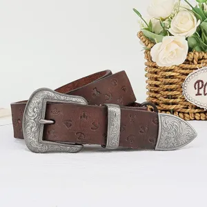 Retro genuine leather belt for women with exquisite embossed floral metal buckle and tip accessory.