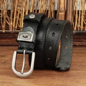 Retro women leather belt with silver pin buckle and vintage decorative metal details for jeans.