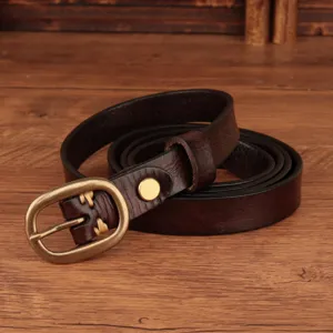 Detailed shot of genuine leather women belt with vintage metal buckle and neat stitching.