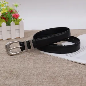 Minimalist women black leather belt with metal horseshoe buckle for stylish casual jeans.