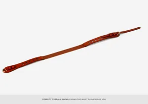 Close-up detail of brown leather stretch waist belt with metal buckle, stylish dress accessory.
