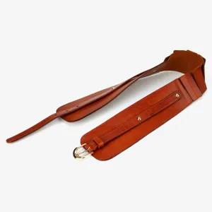 Detailed view of brown wide leather belt, featuring metallic buckle and stylish waist corset design.