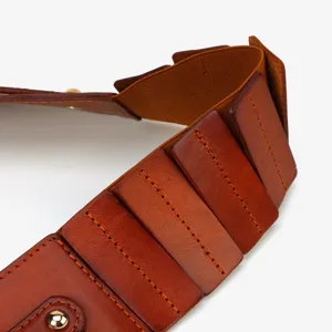 Brown leather wide belt detail, elegant elastic waist cincher for dresses and coats.