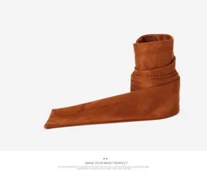 Detailed view of brown faux suede fabric waist belt, soft texture and vintage tie design.