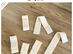 Close-up detail of off-white plush fabric straps with Velcro fasteners for DIY bags