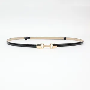 Slim black patent leather belt for women, minimalist waist accessory for dresses and suits.