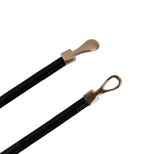 Women's slim leather belt with elegant metallic clasp accessory for stylish dresses and waist.