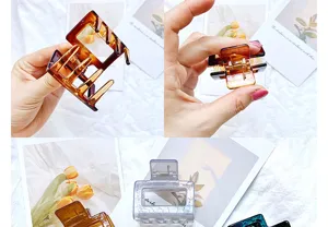 Close-up detail of a minimalist amber hollow geometric hair claw clip for elegant hair