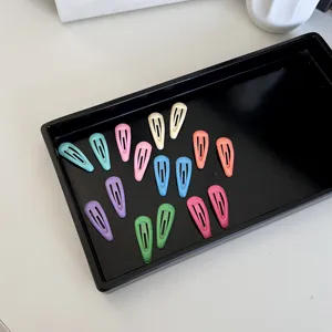 Colorful mini BB hair clips set for babies and pets in a minimalist black tray display.