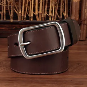 Close-up of a vintage dark brown leather belt with a polished silver-tone pin buckle.