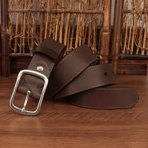 Detailed view of dark brown genuine leather belt with silver pin buckle and stitching