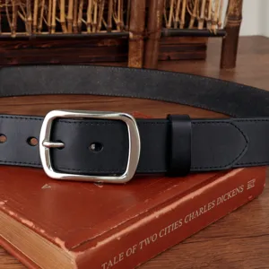 Detailed view of a black retro genuine leather belt featuring a classic silver pin buckle