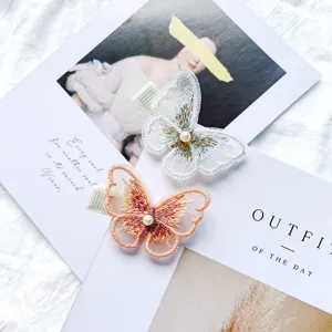 Elegant embroidered butterfly hair clips with pearl accents for sweet girls hair styling