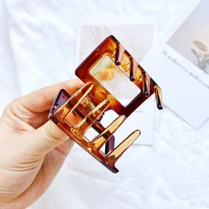 Amber acetate geometric hollow square hair claw clip for women in a medium size