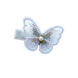 Sweet butterfly hair clip with pearl and iridescent embroidery on white background