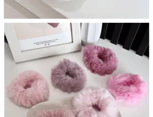 Close-up of multi-colored faux fur scrunchies with soft plush texture.
