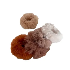 Set of multi-color plush faux fur hair scrunchies for stylish autumn winter hairstyles.