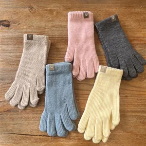 Women's winter warm knitted gloves, cozy touchscreen five-finger solid color stretch mittens.